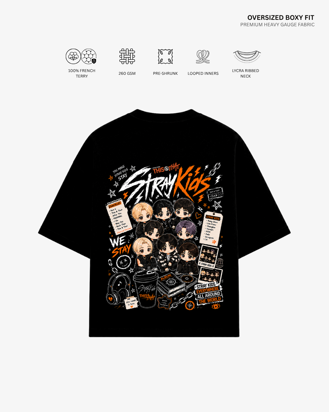 A black oversized boxy-fit T-shirt shown from the back, featuring a large colorful graphic print with the text 'Stray Kids' and illustrated character faces and design elements. Small feature icons and text appear above the shirt on a light gray background.