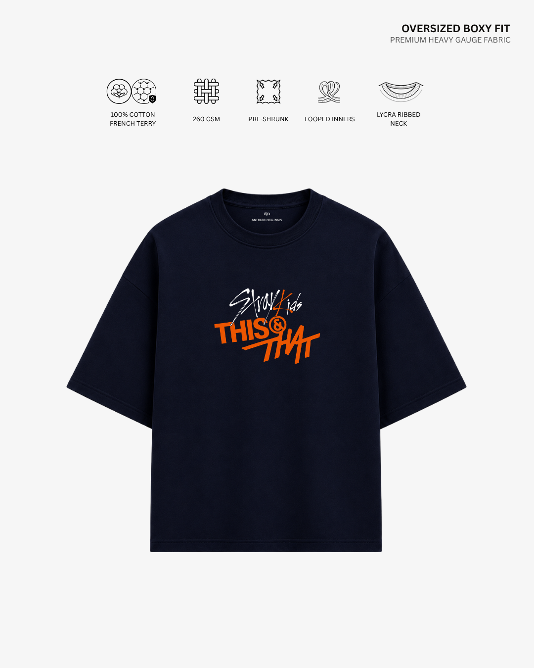 A navy blue oversized short-sleeve t-shirt with a colorful graphic print on the front, displayed on a light gray background with feature icons and text at the top.