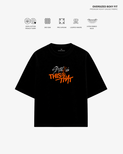 A black oversized short-sleeve T-shirt with a colorful graphic on the chest reading 'Stay like THIS & THAT' in white and orange, shown on a light gray background with feature icons and text above.